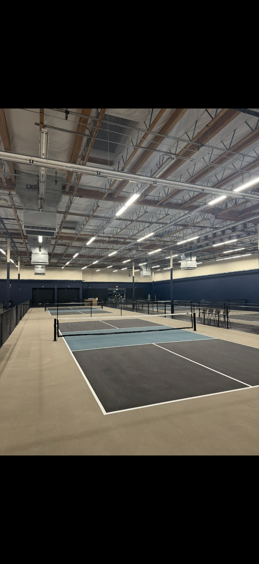 Indoor pickleball courts at DINKERS Pickleball Lounge in Henderson, NV